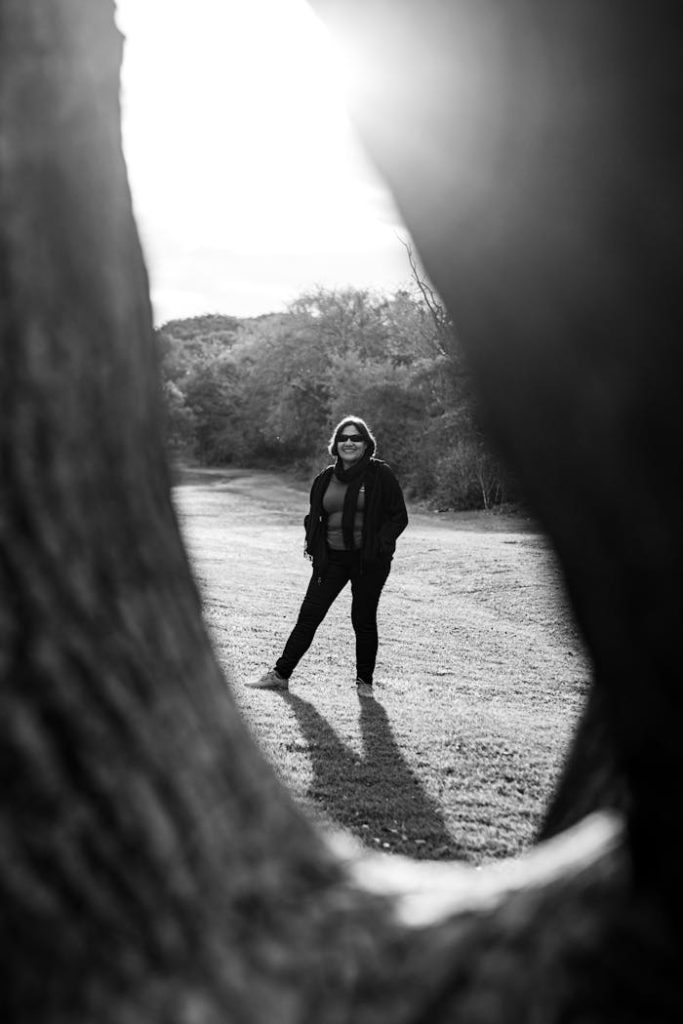 A striking black and white portrait framed by trees in Buenos Aires.